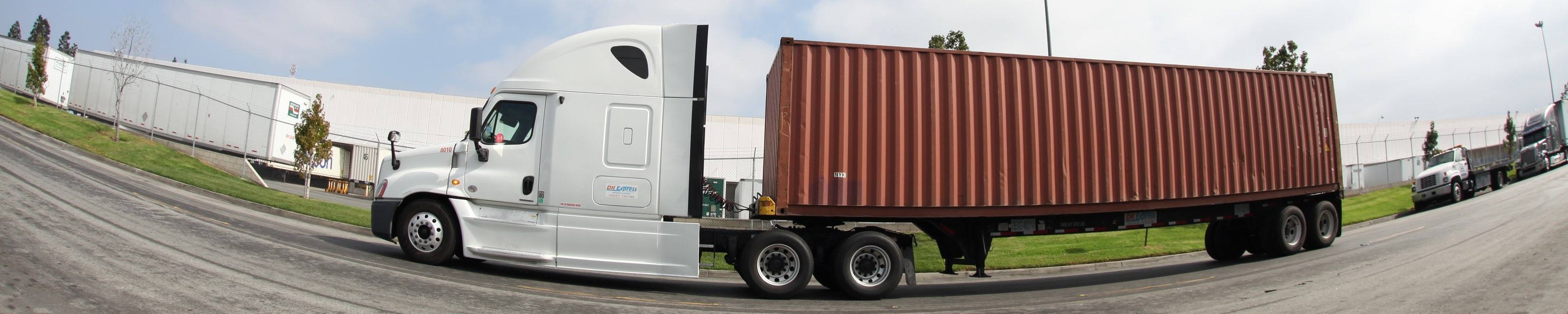 DK Express tractor 8010 with a container, wide view