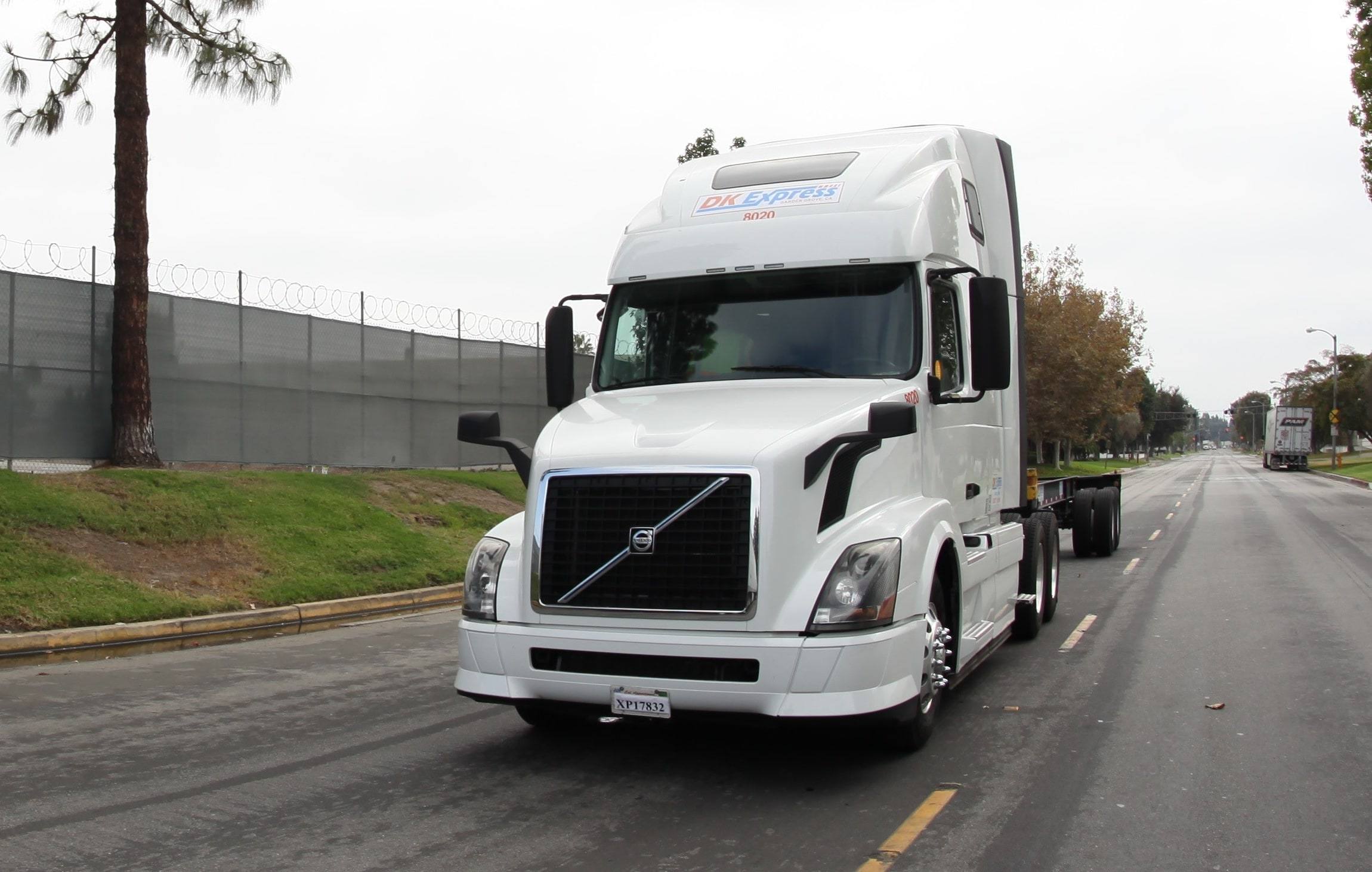 Front view of DK Express Volvo tractor 8020 on the road