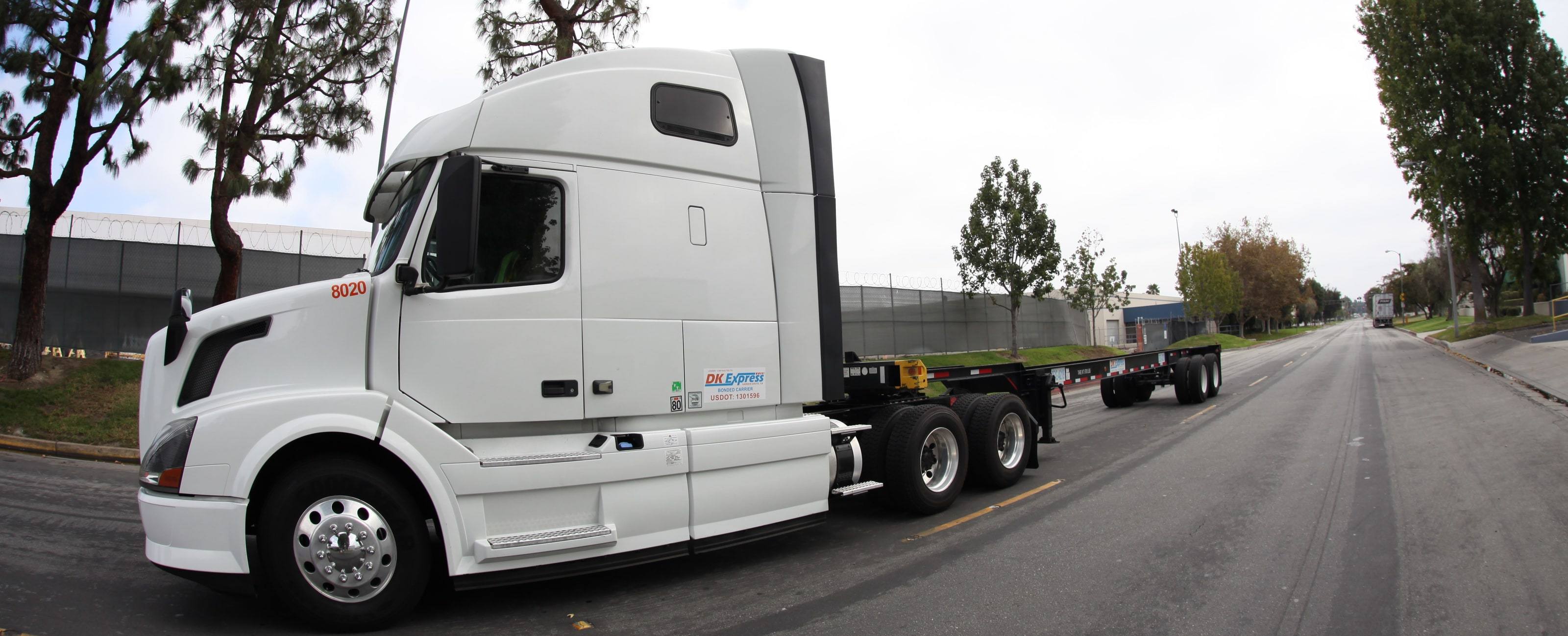 DK Express tractor 8020 with an empty chassis on a Southern California street